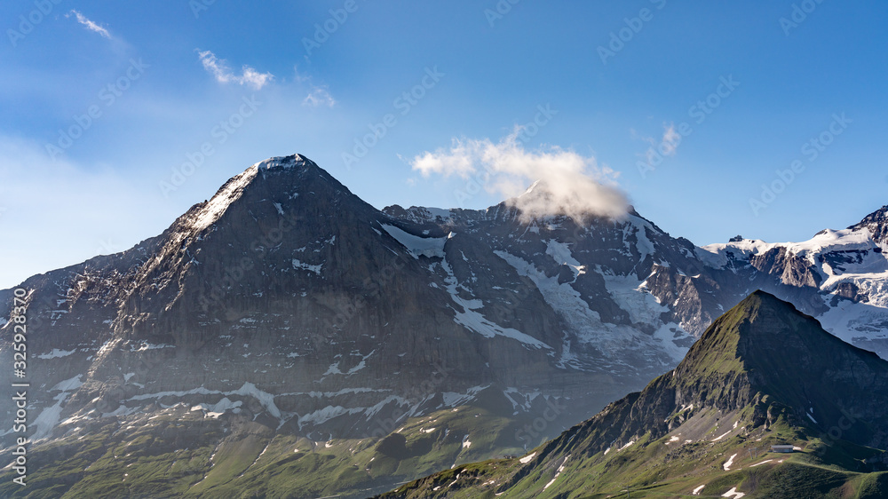 Switzerland, Panoramic view on Eiger, Monch and Yungfrau and green Alps around Mannlichen