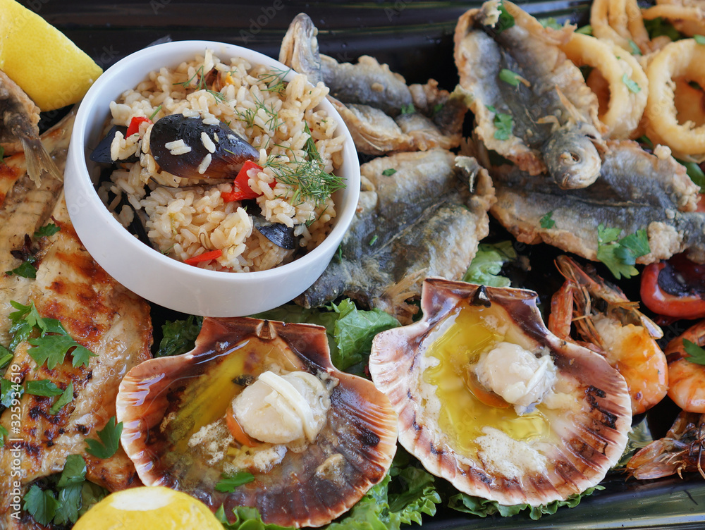 Mediterranean Kitchen. Pilaf with mussels - crumbly rice with mussels and spices and seafood