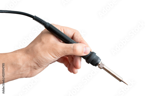 Soldering iron in man's hand isolated on white background. Hands Holding electronic equipment photo