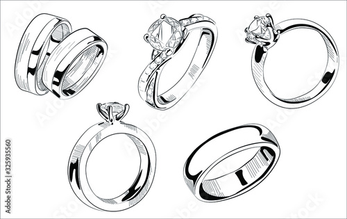 Vector hand drawn illustration of jewelry wedding and engagement rings set in vintage engraved style. Isolated on white background.