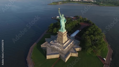 Gorgeous drone aerial view on statue of Liberty monument USA America national symbol in evening sunset ocean seascape