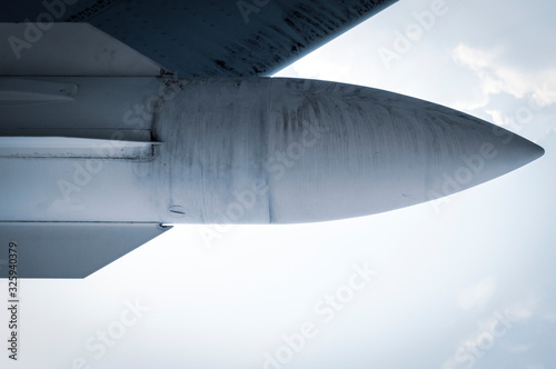 combat missile under the wing of the aircraft close-up
