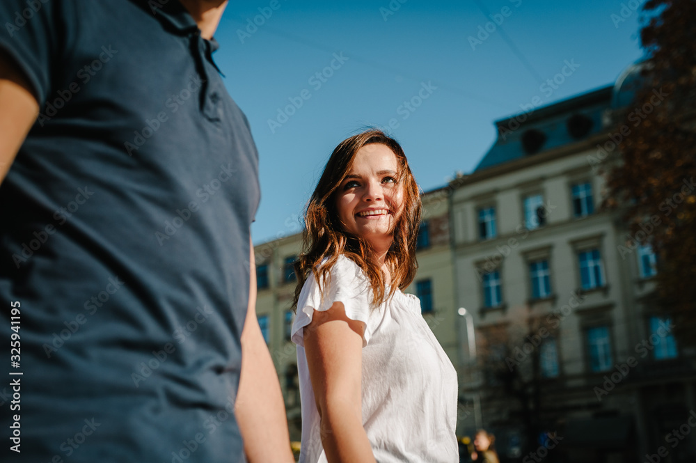 Naklejka premium Happy loving couple enjoying in moments of happiness outdoors. Love and tenderness, dating, romance. Lifestyle concept.
