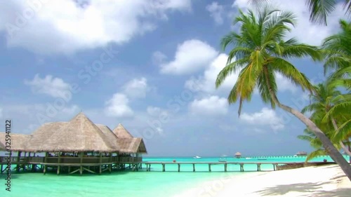 Amazing steady shot of luxury resort bungalow hotel apartment in turquoise clear ocean tropical paradise Maldives island