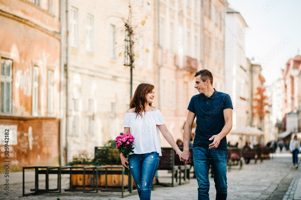 Happy loving couple enjoying in moments of happiness outdoors. Love and tenderness, dating, romance. Lifestyle concept.