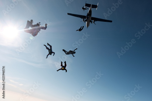 Fototapeta Naklejka Na Ścianę i Meble -  Skydiving. A group of skydivers is in the sky.