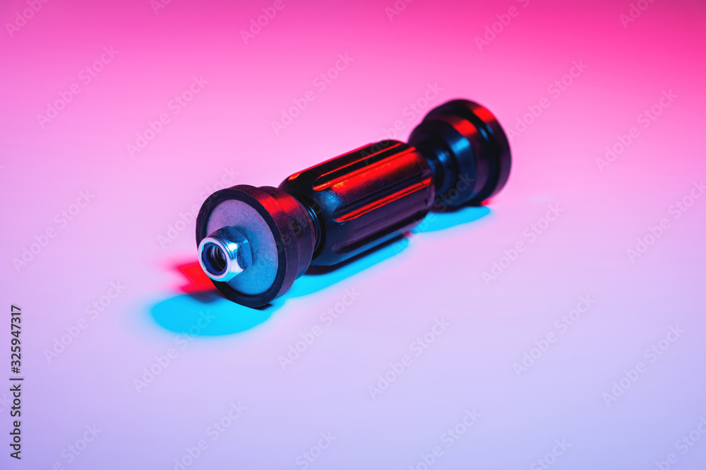 Car front suspension anti-roll bar mount. New tie rod in double red-blue light Car front suspension anti-roll bar mount. New tie rod in double red-blue light