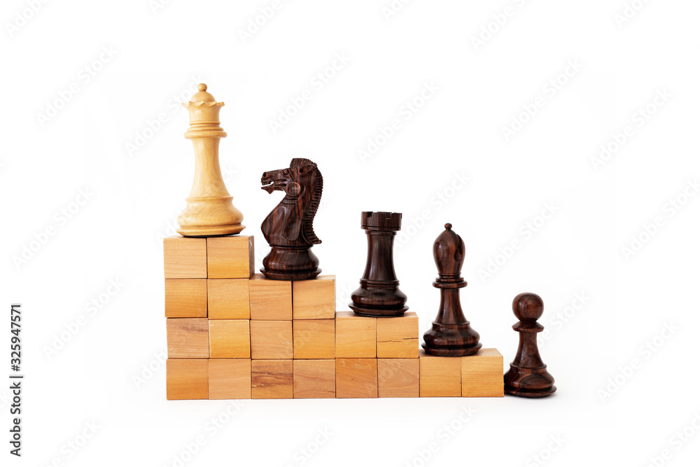 Chees pieces on a stair building with wooden blocks isolated with white, metaphoring hierarchy, ranking, teamwork and strategy in business concept.