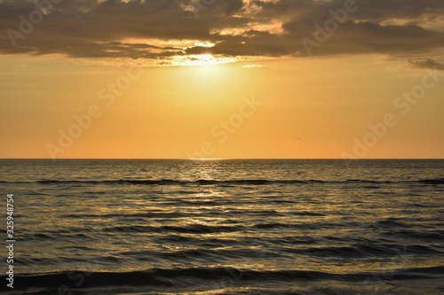 Golden sunrise at sea background  USA.