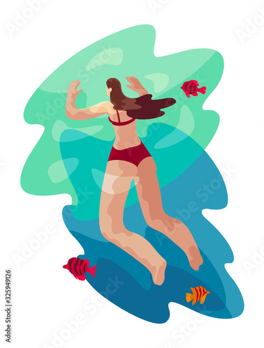 Woman is Swimming in the Blue Water of Ocean omn Vacation in Tropical Country