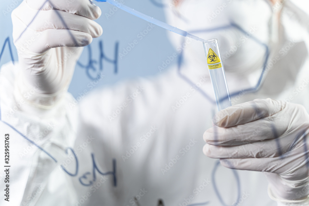 Close up of male hand that holding test tube Close up of male hand that holding test tube