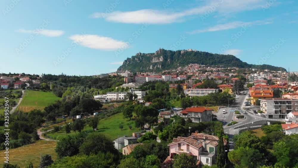 Aerial landscape view from distance on main city rock of San Marino Republic in the background. The concept of the best places for tourism and journey. Down town, Italy Aerial landscape view from distance on main city rock of San Marino Republic in the background. The concept of the best places for tourism and journey. Down town, Italy