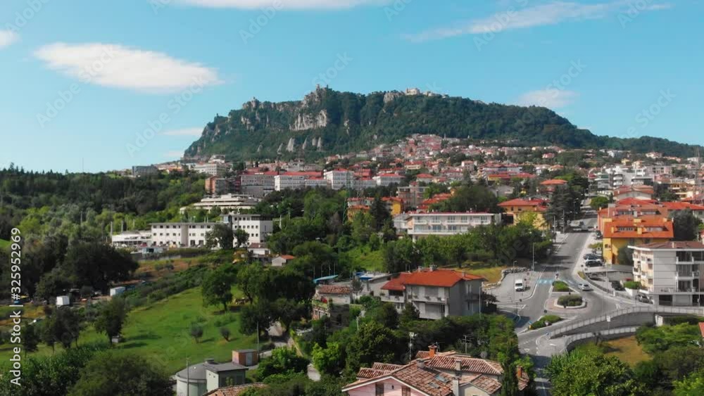 Aerial landscape view from distance on main city rock of San Marino Republic in the background. The concept of the best places for tourism and journey. Down town, Italy Aerial landscape view from distance on main city rock of San Marino Republic in the background. The concept of the best places for tourism and journey. Down town, Italy