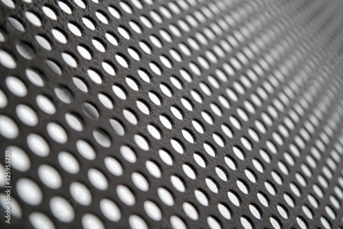 Texture of perforated metal sheet abstract background. Detailed texture background gray sheet metal perforated.