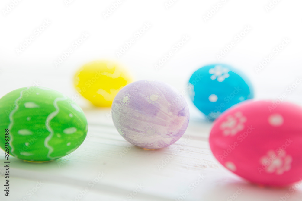 Easter eggs on a white wooden surface