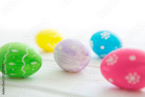Easter eggs on a white wooden surface