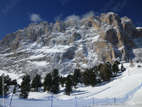 view of the ski slope up to the mountain langkofel photo