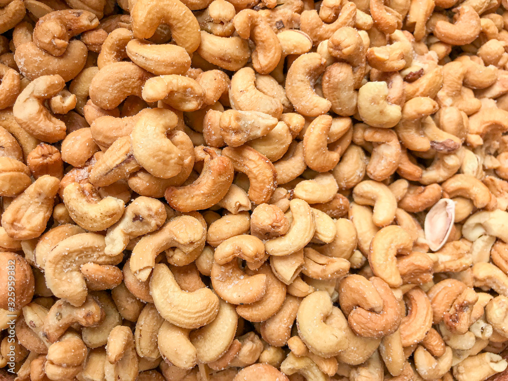 Close-Up Of Cashew Nuts Peeled. Healthy Fresh Food Background.