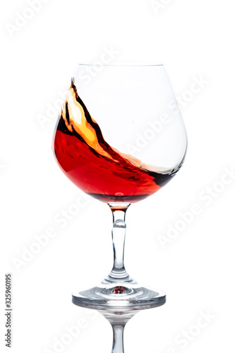 Snifter of brandy isolated on white background.