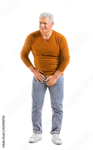 Mature man with urologic disease on white background