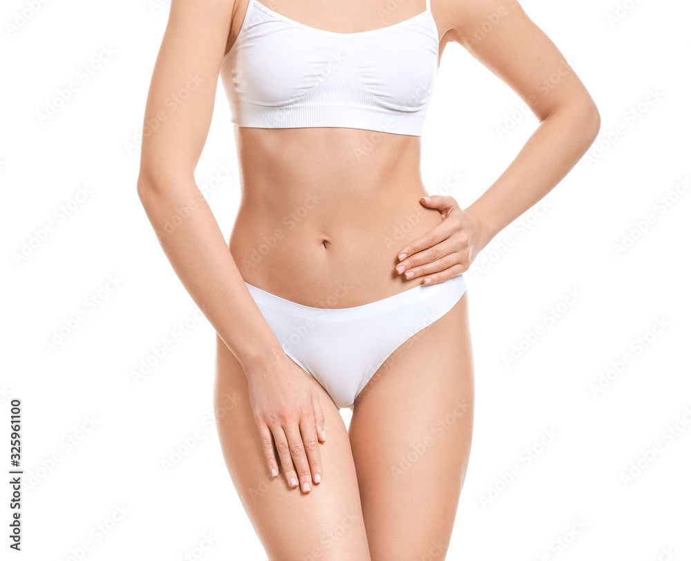 Young woman in underwear on white background. Concept of plastic surgery