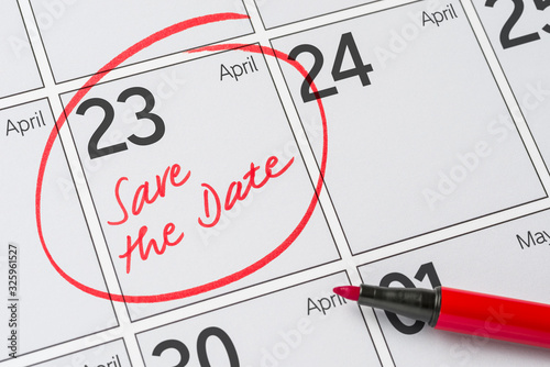 Save the Date written on a calendar - April 23 photo