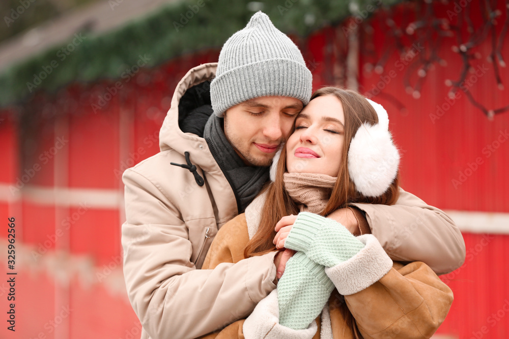 Portrait of happy young couple on romantic date outdoors