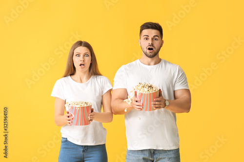 Shocked young couple with p...