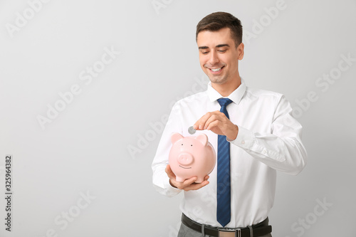Handsome businessman with p...