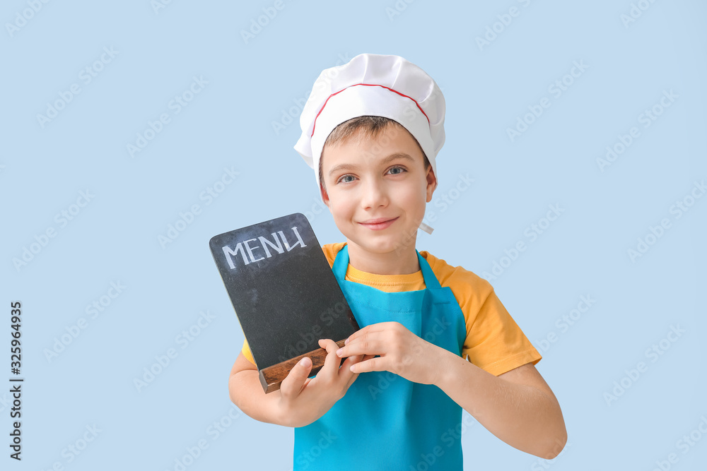 Cute little chef with menu on color background Cute little chef with menu on color background