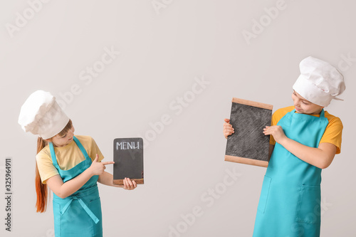 Cute little chefs with menu...