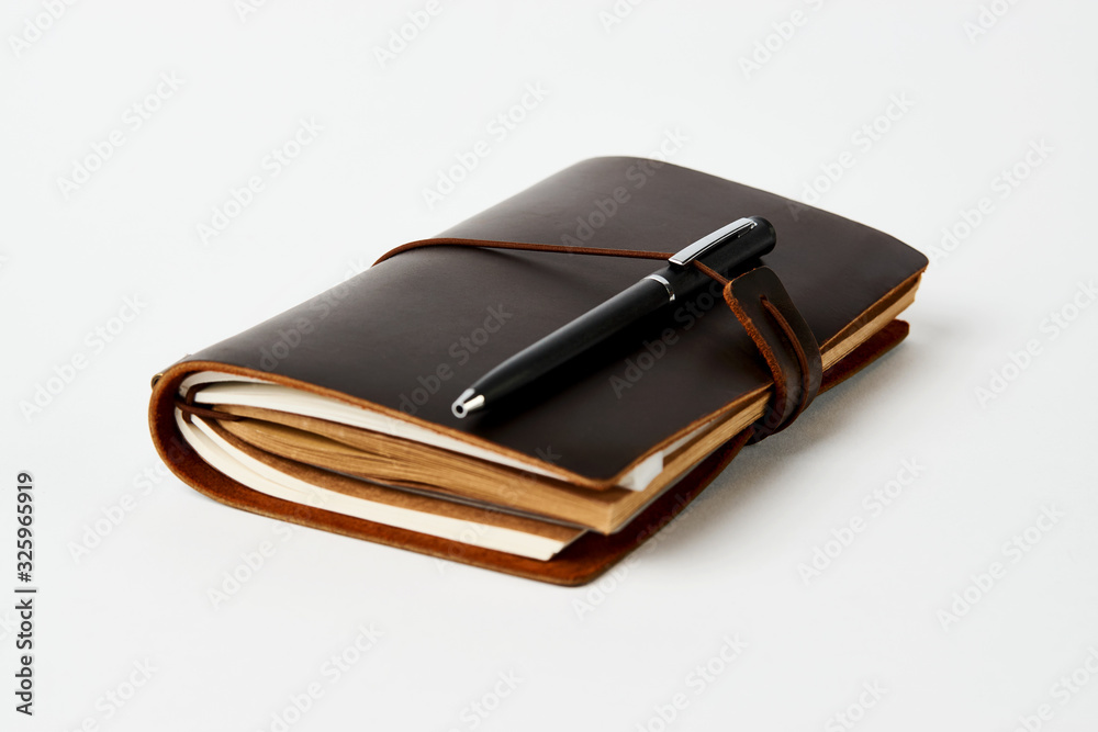 Business contact book and pen, close-up Business contact book and pen, close-up