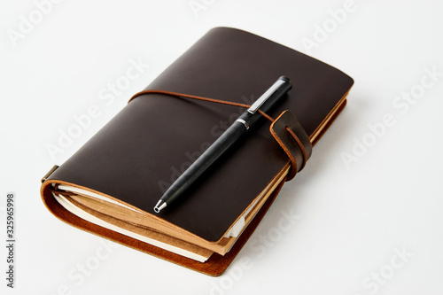 Business contact book and pen  close-up