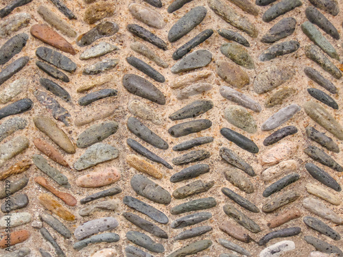 Cobblestone pattern with herringbone ornament closeup