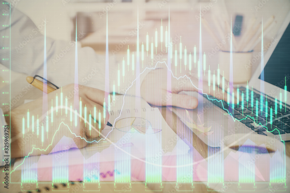 Multi exposure of stock market graph with man working on laptop on background. Concept of financial analysis. Multi exposure of stock market graph with man working on laptop on background. Concept of financial analysis.