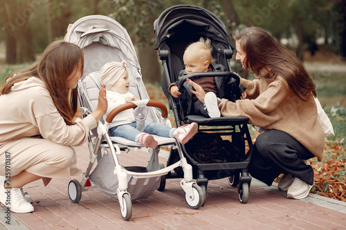 Mothers with children. Women use the carriages. photo