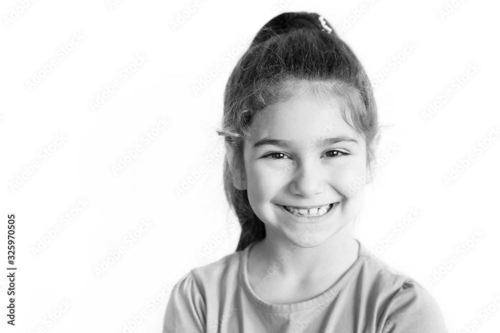 Portrait of happy laughing child girl. Smiling kid. Positive emotions. Black and white image Portrait of happy laughing child girl. Smiling kid. Positive emotions. Black and white image