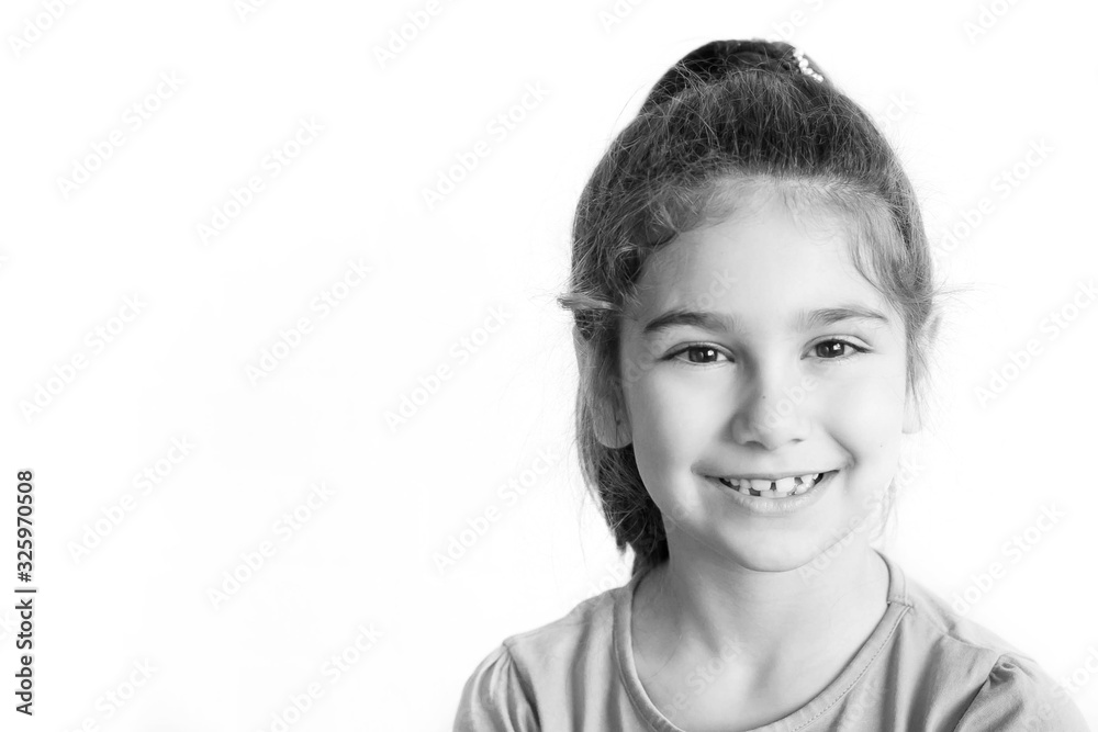 Portrait of happy laughing child girl. Smiling kid. Positive emotions. Black and white image Portrait of happy laughing child girl. Smiling kid. Positive emotions. Black and white image