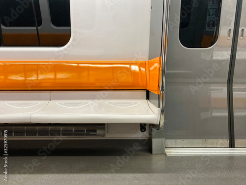 Orange and white subway seats