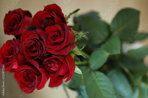 bouquet of red roses on a wooden background