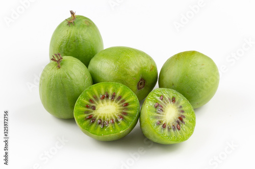 hardy kiwi fruits isolated on white copy space