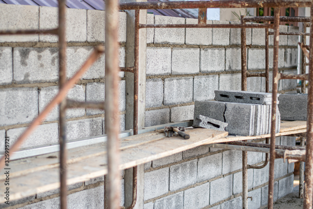 Stack of brick bricks on wood for building houses on the construction site. architecture and interior on site concept