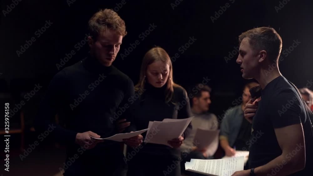 Two actors argue holding script