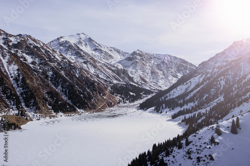 Beautiful mountains with frozen lake in sunny winter day. BAO or big almaty lake. © Adil