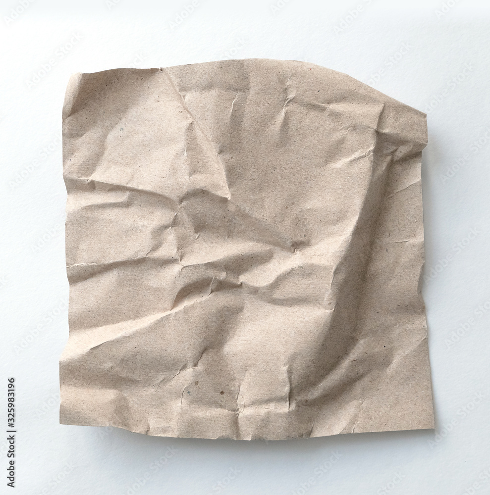 Obraz premium Brown wrinkle recycle paper background. Crumpled brown paper on white background.