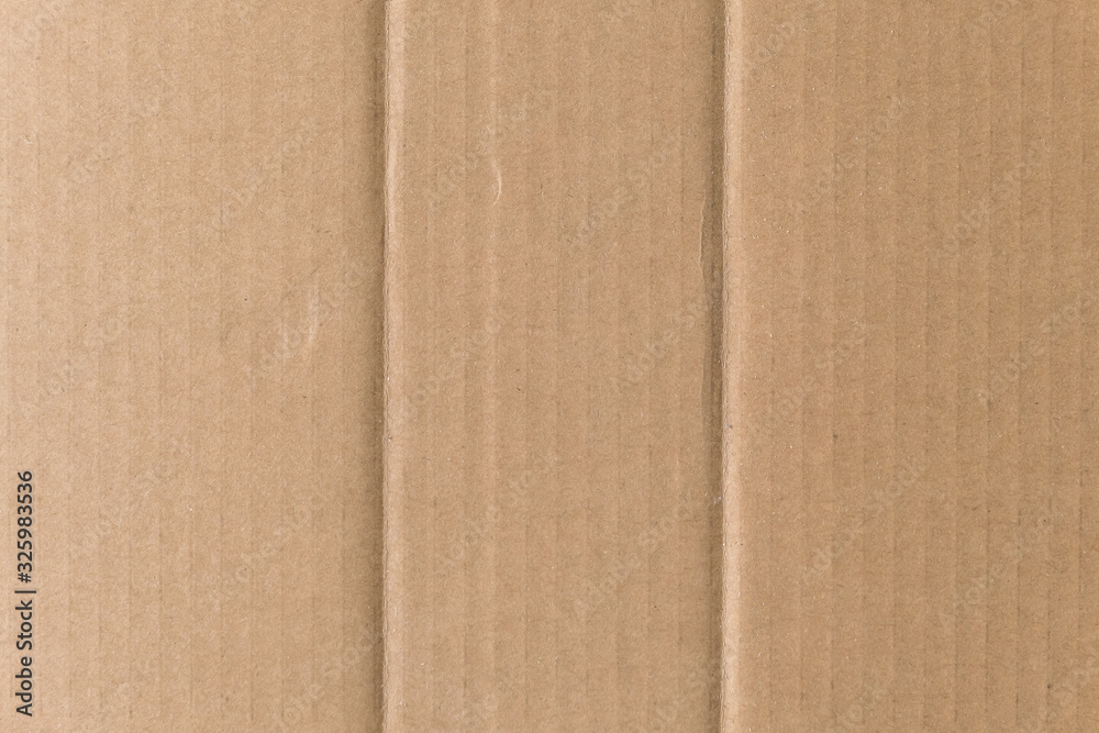 Fototapeta premium Brown cardboard sheet texture background. Texture of recycle paper box in old vintage pattern background.