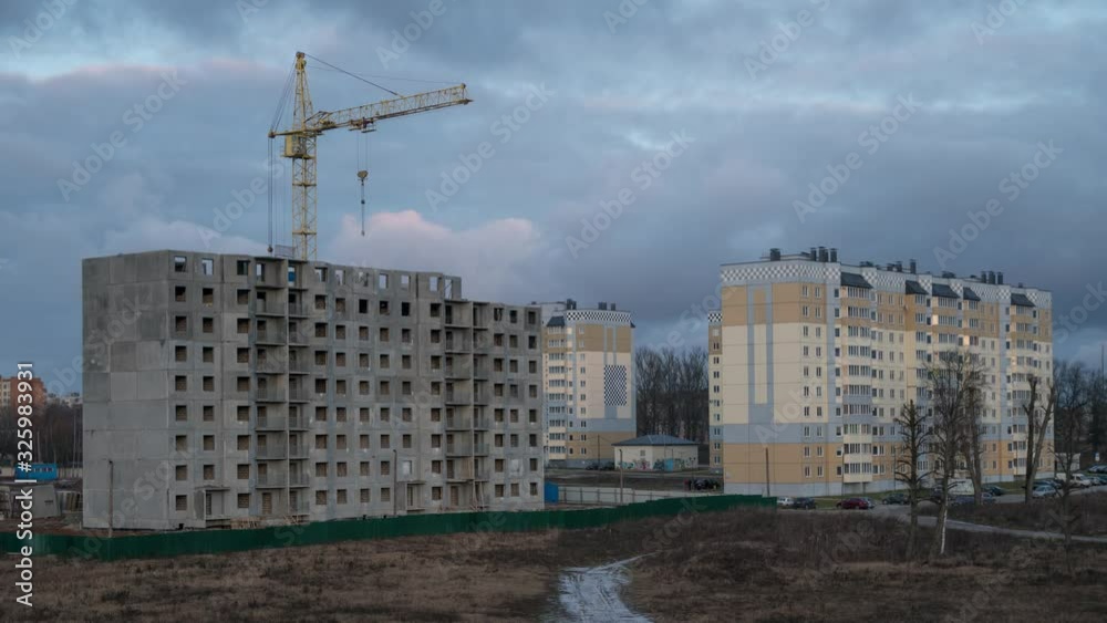 frames represent the time lapse of a construction site. It depicts a huge crane, real estate. Clouds swiftly. frames represent the time lapse of a construction site. It depicts a huge crane, real estate. Clouds swiftly.