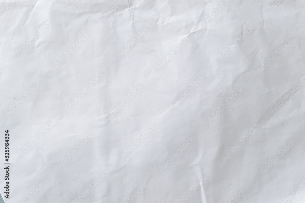 White crumpled paper pattern and texture for background. White creased paper background.