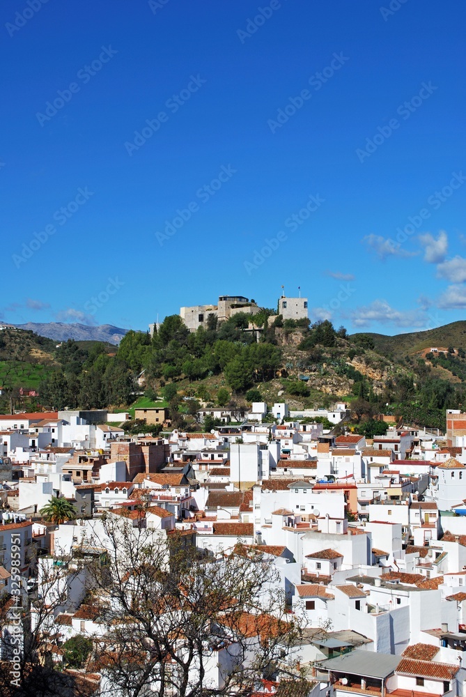 General view of the town with the castle on the hilltop, Monda, Spain.