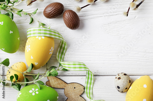 Canvas Print easter eggs on wooden background, copy space for text